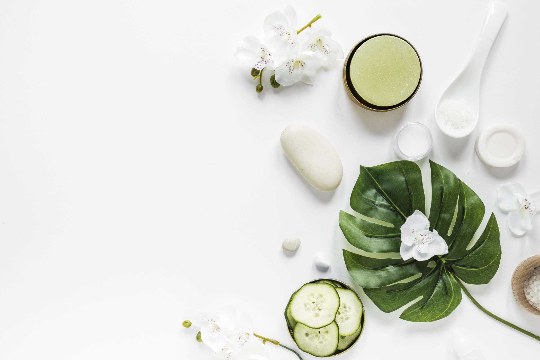 Leaf with oil for spa and cucumber slices kept on bowl